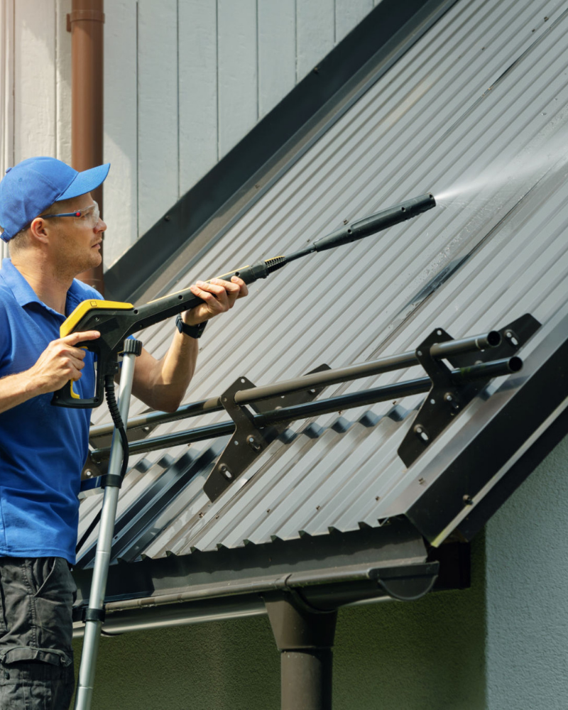 Professional house siding washing in progress